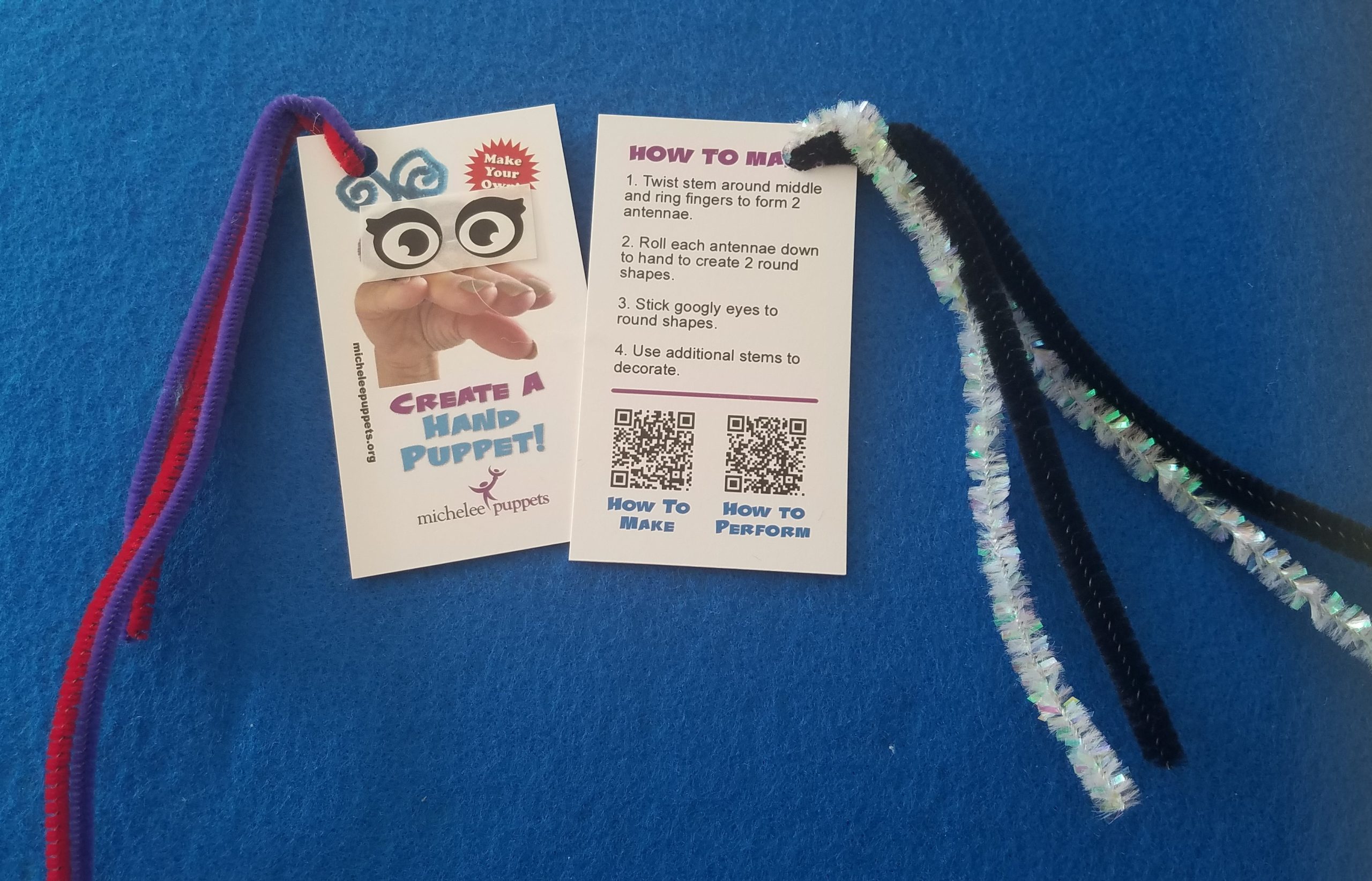 Pipe cleaners attached to instruction cards for making a hand puppet